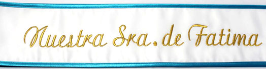 white and blue pageant sash with gold letters