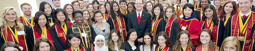students wearing graduation sashes
